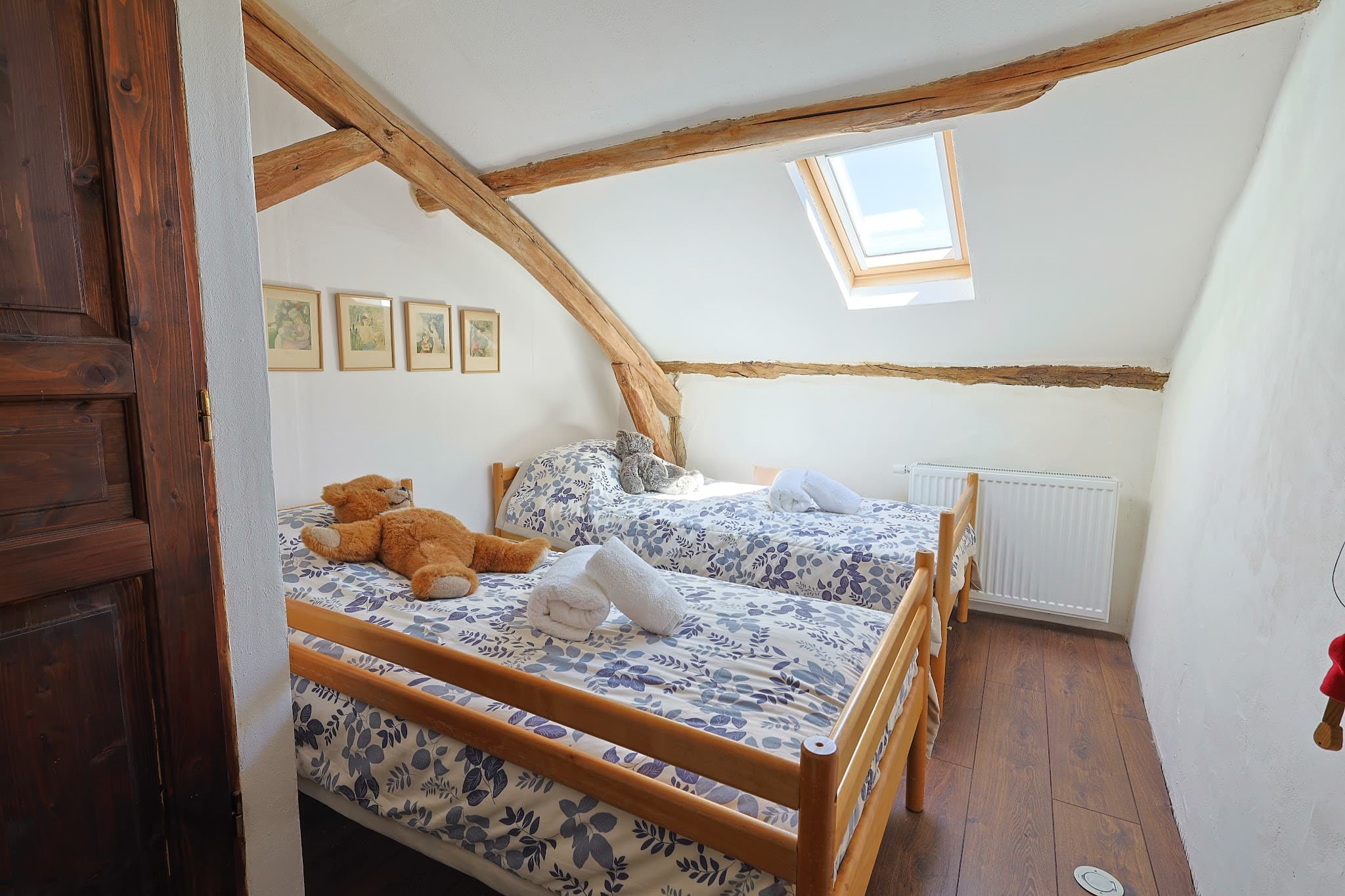 The children's bedroom at The Friends' House, with two beds under the roof.