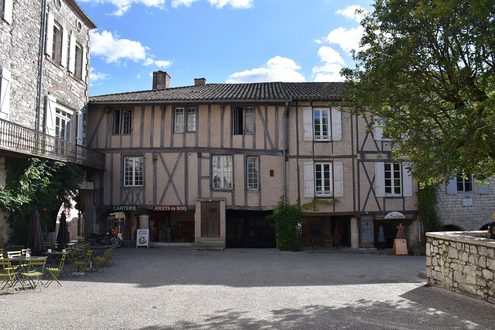 The square of the bastide town of Monflanquin, lined with half-timbered houses.