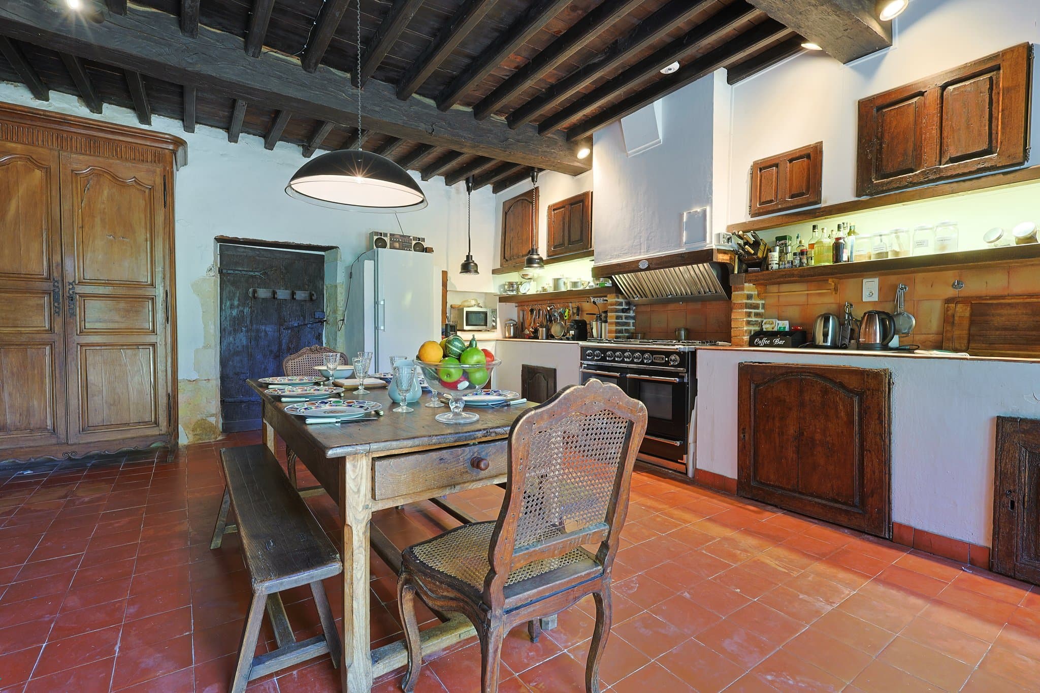 The kitchen and its dining table at Chez Momône.