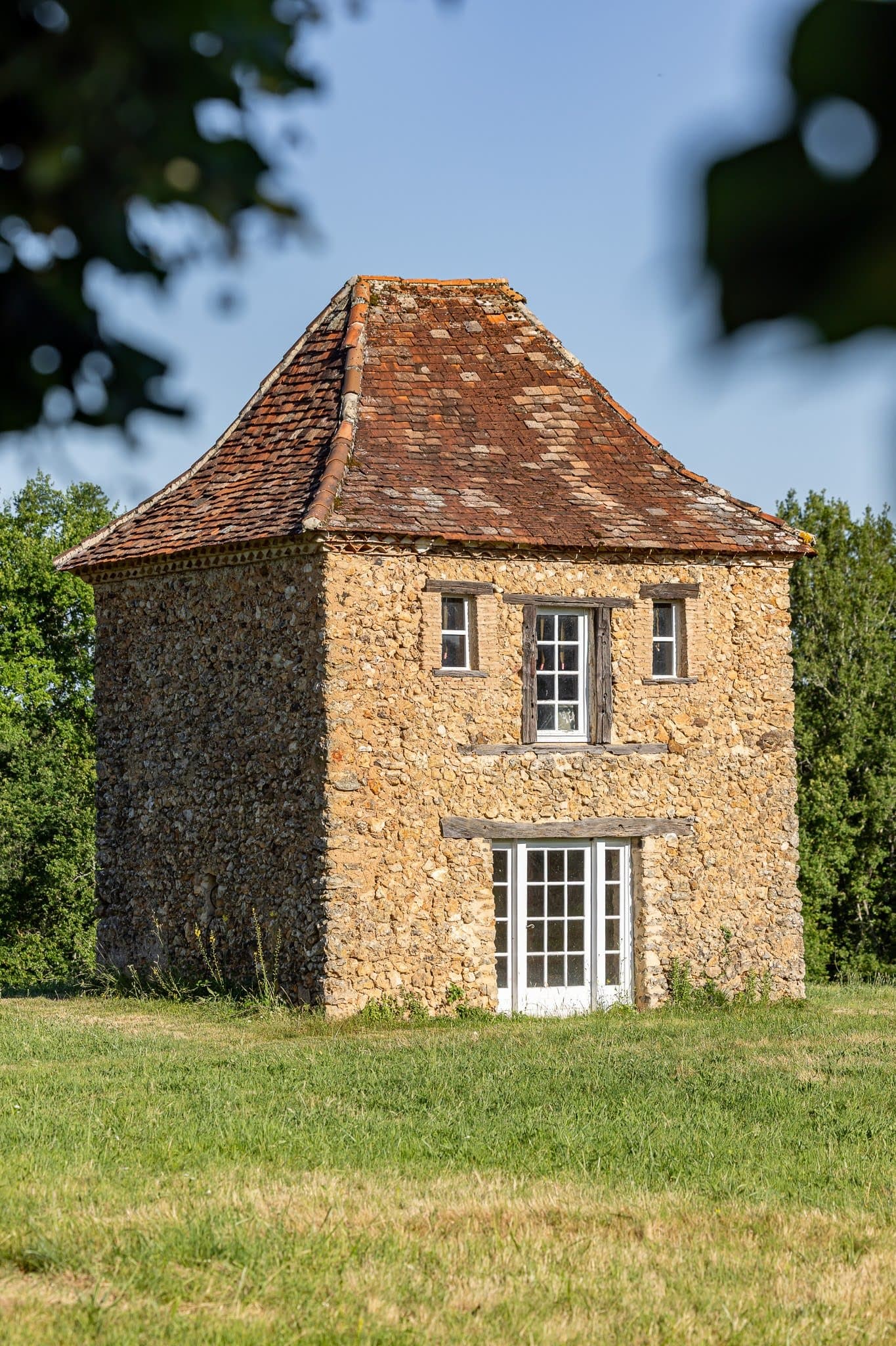 The pigeonnier at Le Clos de Moncouche, standing in the meadows.